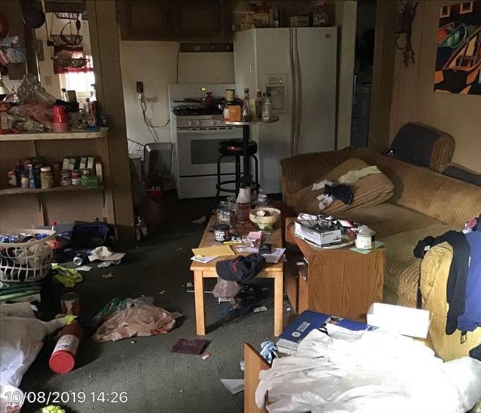 Room with a lots of trash on the floor