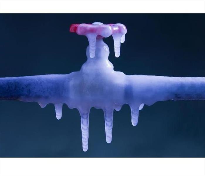 Frozen pipe covered in ice. 